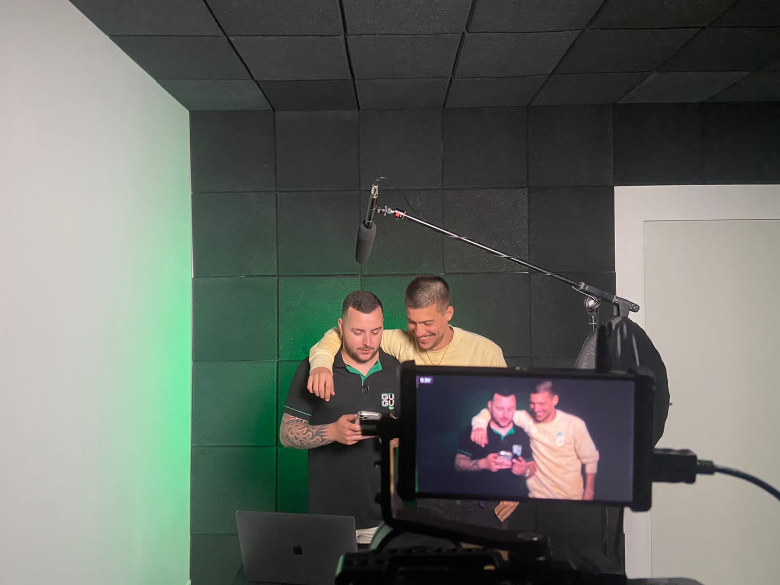 André and a friend on a video shoot set with a boom microphone